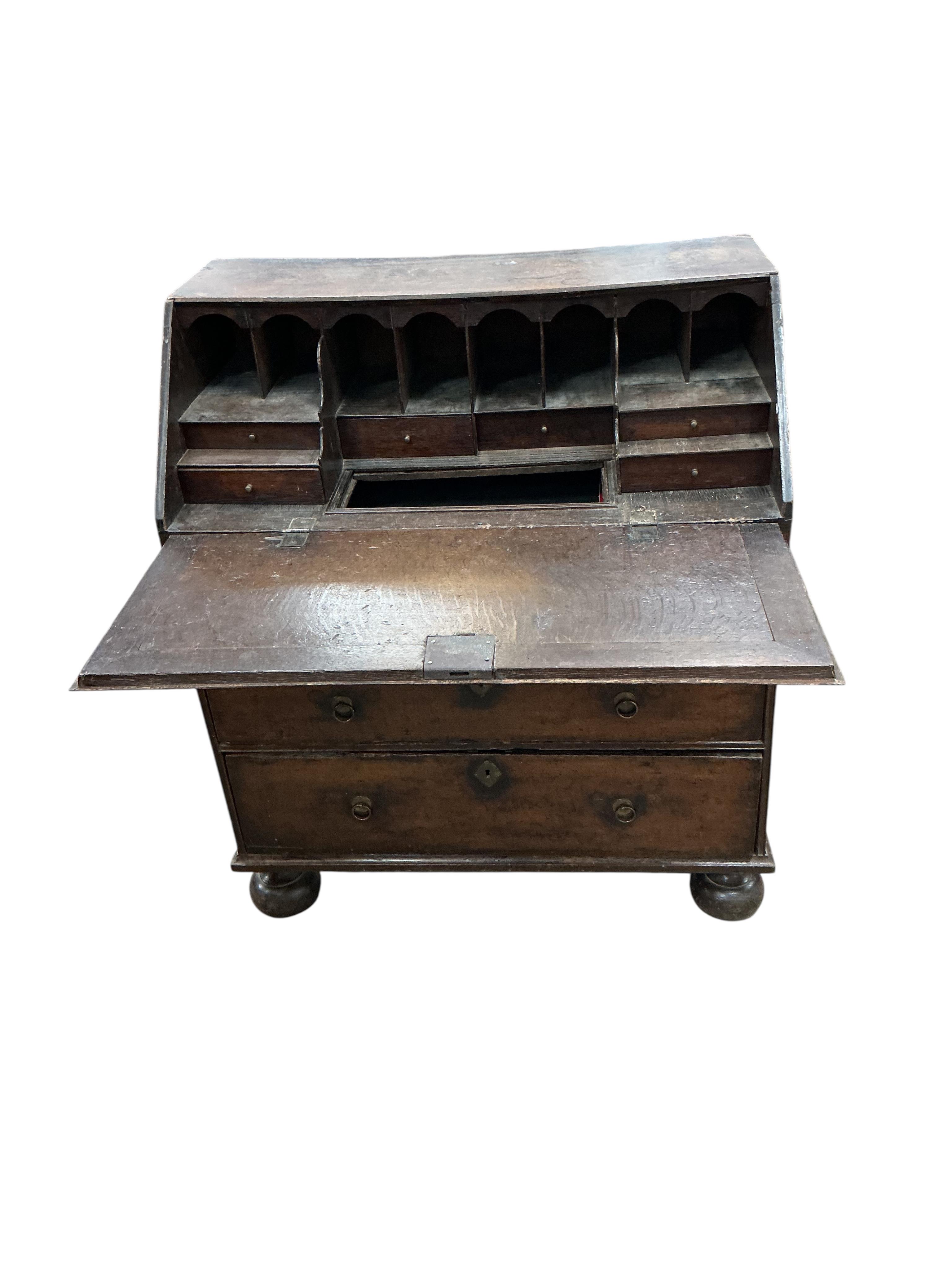 A mid 18th century oak bureau, width 86cm, depth 50cm, height 101cm